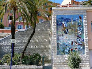 Picture of the stunning colors of French Riviera. A mosaic on a brick wall in Menton. France