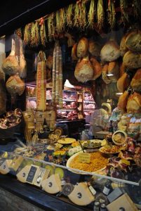 Food Market, Bologna, Italy. Picture of salami, ham and cheese in the market. The famous Mortadella of Bologna